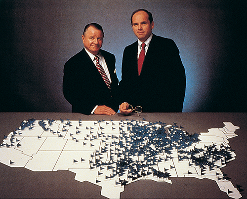 2 Edward Jone men looking at a map